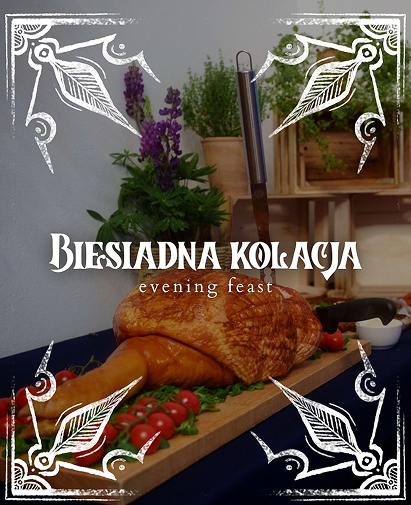 Cover image for 'Biesiadna kolacja' showing a roasted turkey on a cutting board with herbs, vegetables, and a carving knife, framed by a white decorative border; subtitle reads 'evening feast'.