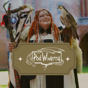 Person in medieval cosplay with face markings, orange braided hair, fur cloak, holding a staff, and a falcon perched on their gloved arm.